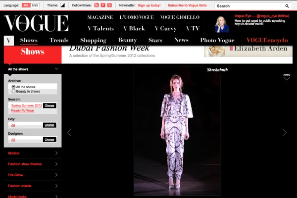Model wearing a printed white and grey jumpsuit by Shrekahnth on the runway at Dubai Fashion Week Spring/Summer 2012, featured in Vogue Italia.